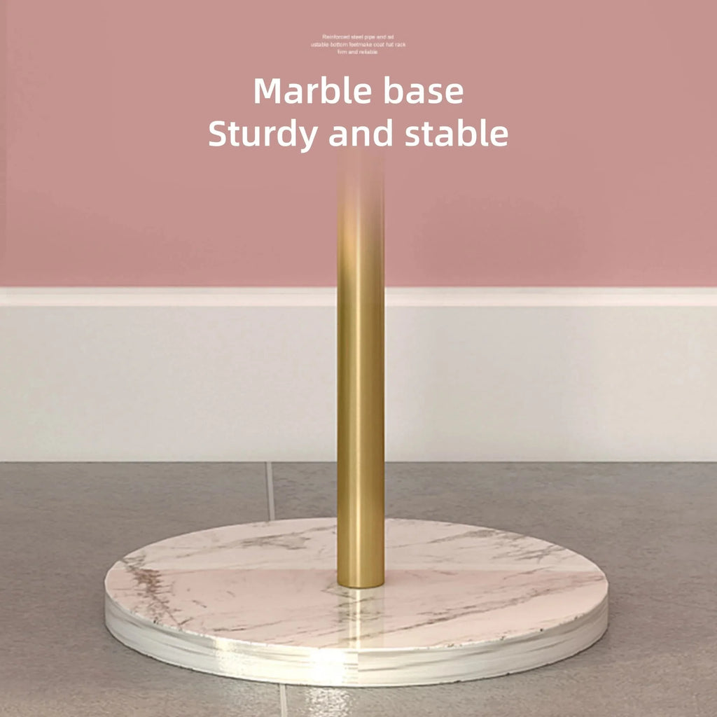 Porte manteau doré avec une base en marbre