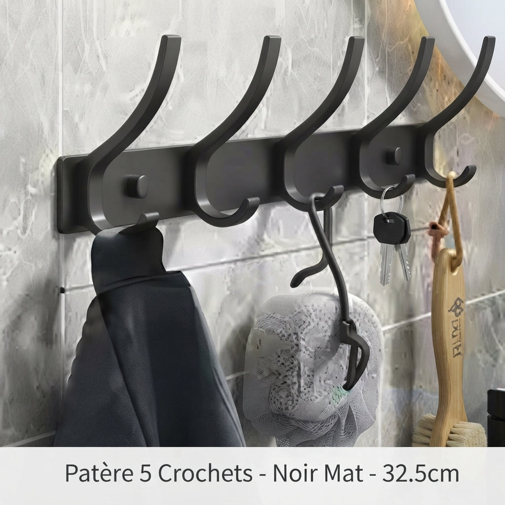 Matte black 5-hook wall coat rack holding jacket, loofah, and keys