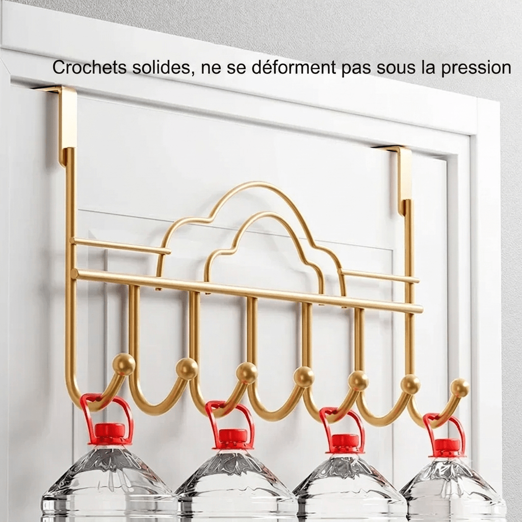 Gold metal door hook rack with cloud design holding heavy water bottles