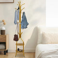 Porte manteau sur pied perroquet gold avec plateau de rangement portant des vetements et accsoires 