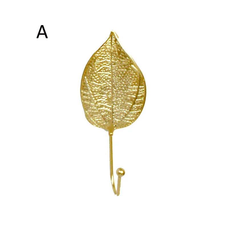 Single gold monstera leaf wall hook detail